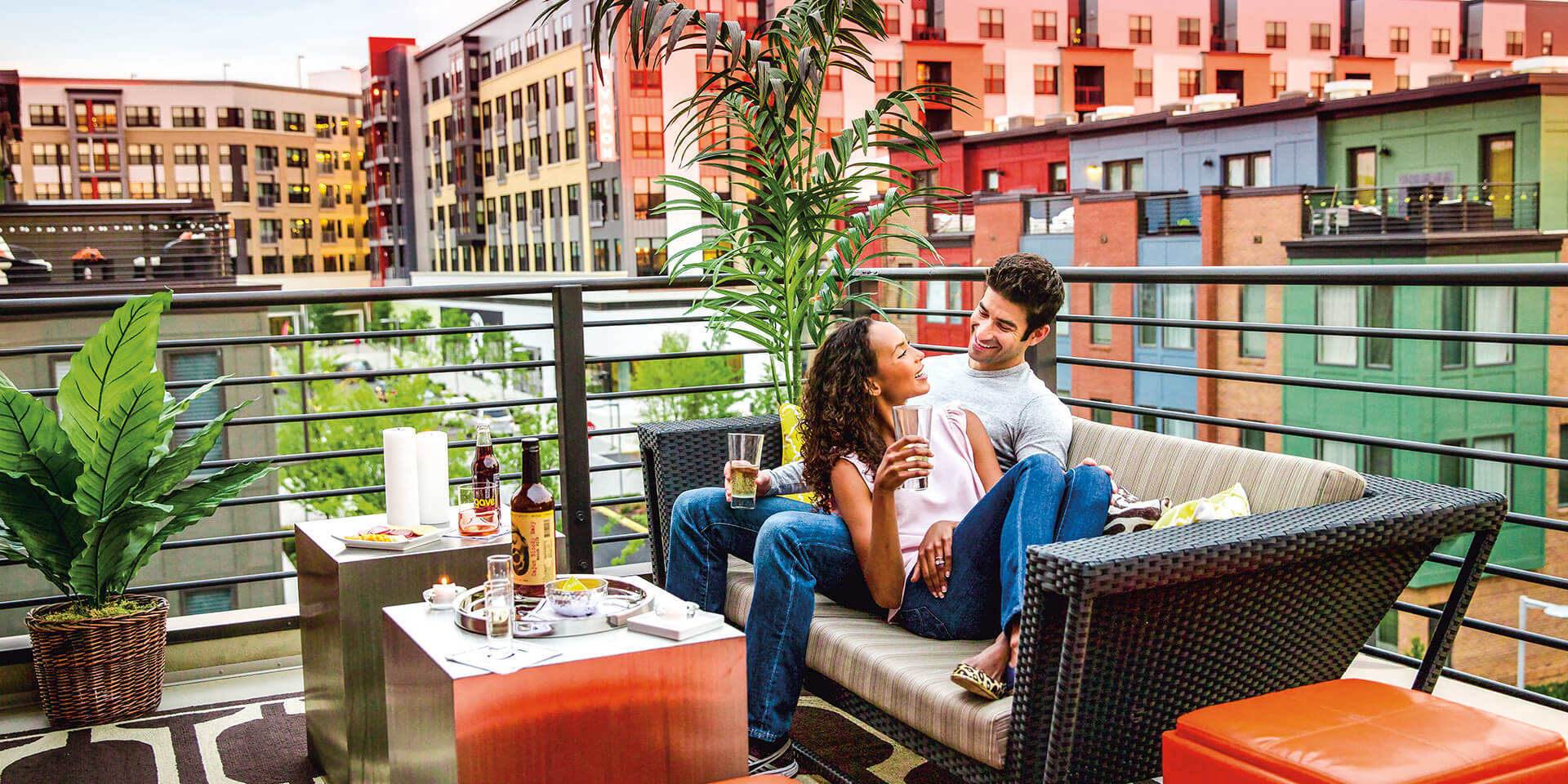 picture of couple sitting on a rooftop terrace