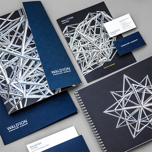 Waldron's rebranding efforts included incorporating the new design, logo, and mantra in day-to-day materials like folders and business cards.