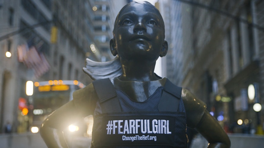 image of Fearless Girl wearing 'Fearful Girl' vest