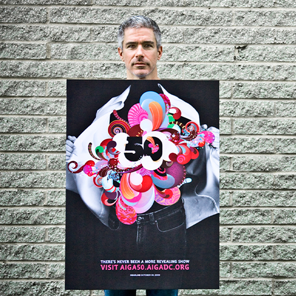 Gregg Glaviano, Creative Director, holding the AIGA50 (American Institute of Graphic Arts) poster