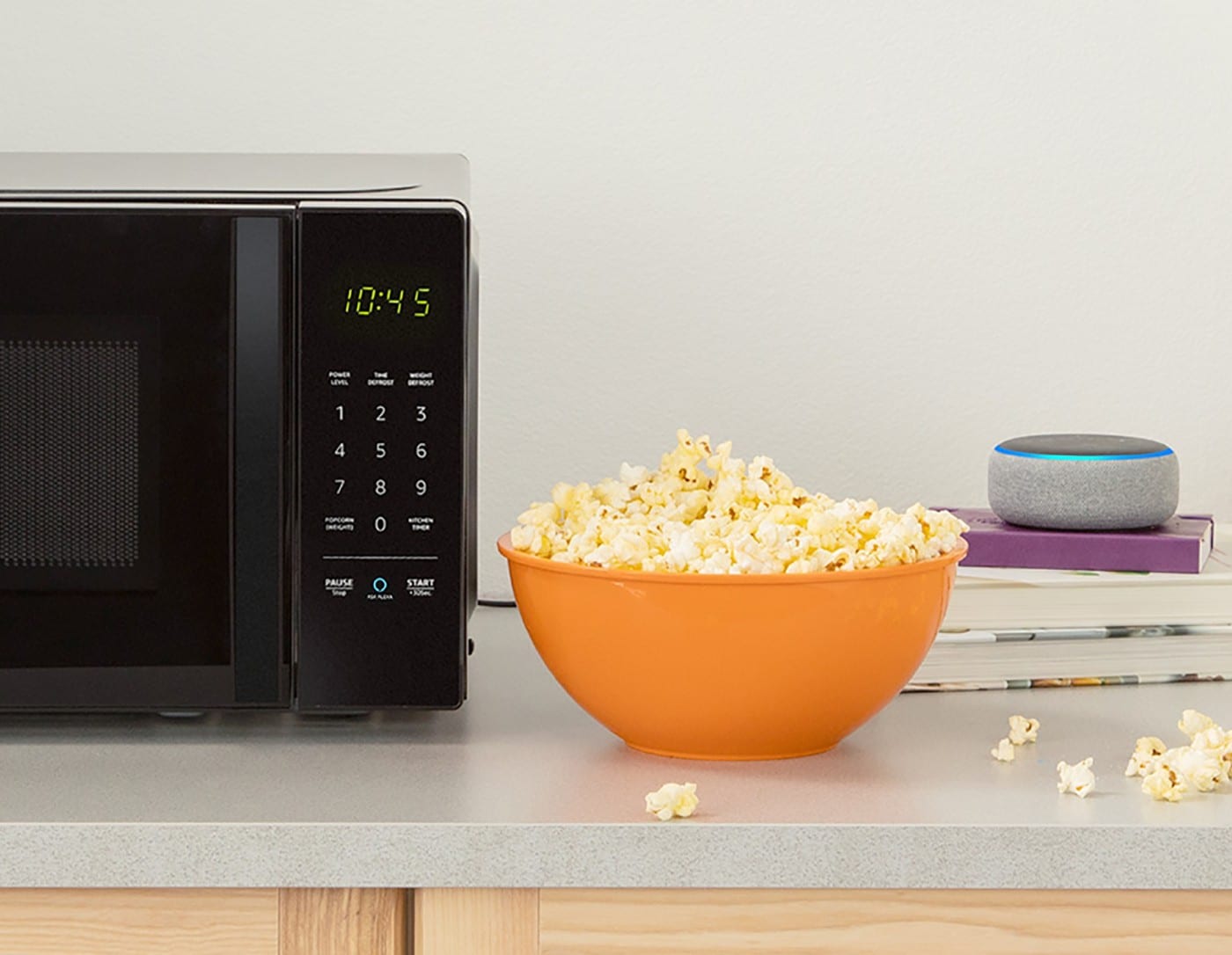 An image of a microwave and a bowl of popcorn.