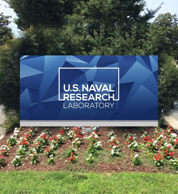 US Naval Research Lab Logo on board in a garden