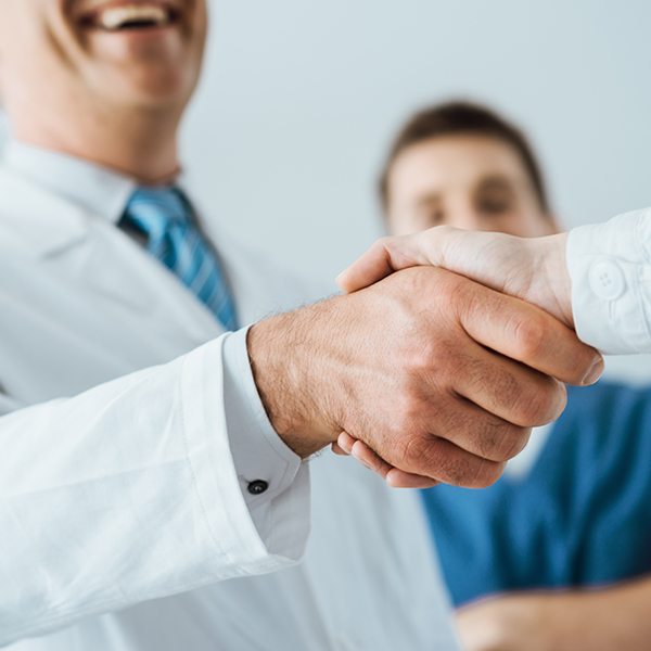 A doctor shaking hands with someone